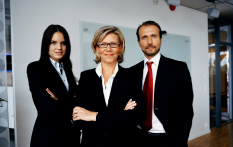 three people in business suits